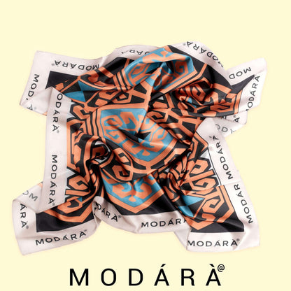 Colorful patterned scarf with 'MODÔRA' branding on a light yellow background